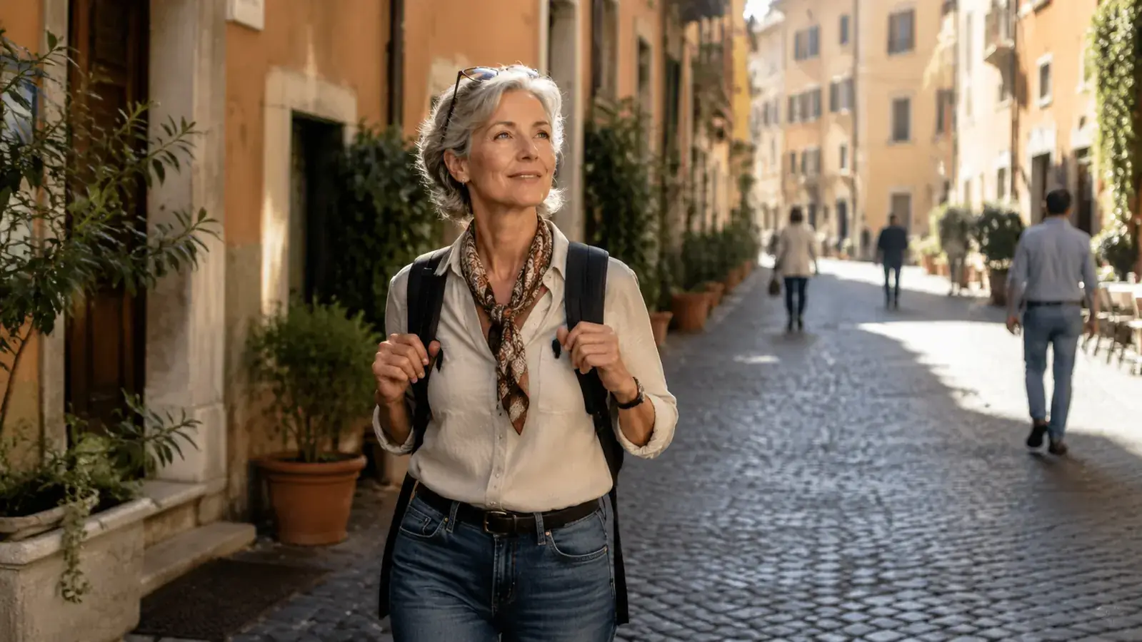 Woman walking confidently on cobblestone street in Rome with a daypack, looking comfortable and energetic